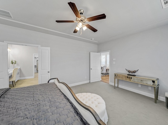 bedroom featuring baseboards, visible vents, and light colored carpet