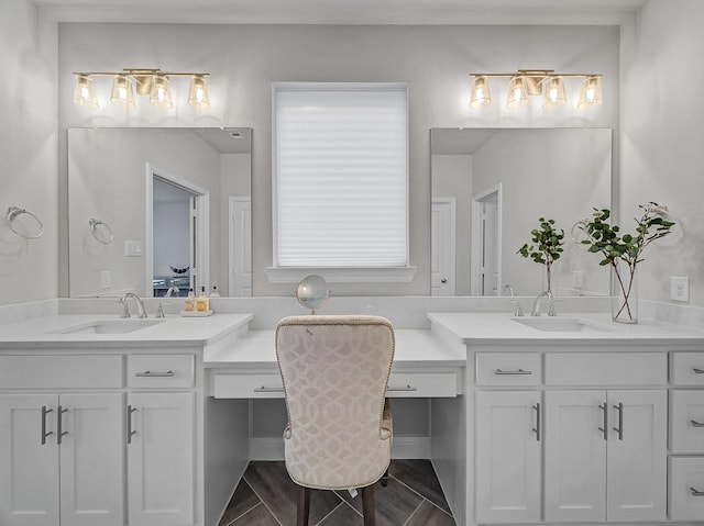 bathroom featuring two vanities and a sink