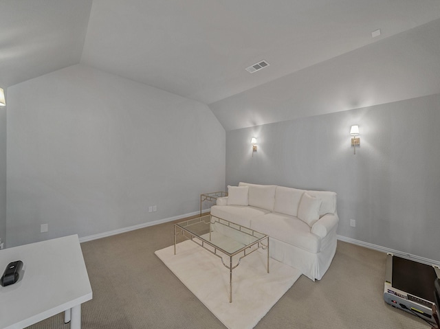 living area with lofted ceiling, carpet, and visible vents