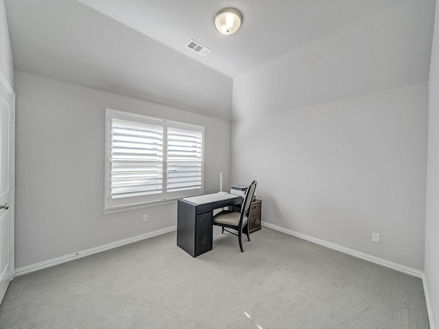 office space featuring lofted ceiling, baseboards, visible vents, and carpet flooring