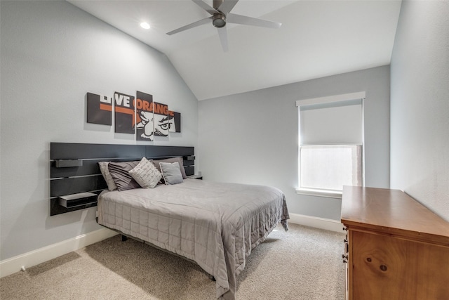 bedroom featuring light carpet, ceiling fan, baseboards, and lofted ceiling