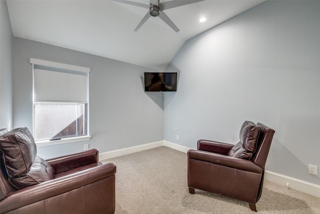 sitting room featuring vaulted ceiling, carpet, a ceiling fan, and baseboards