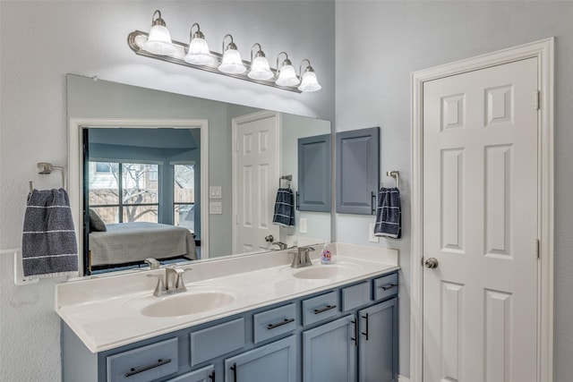 full bathroom featuring a sink, ensuite bathroom, and double vanity