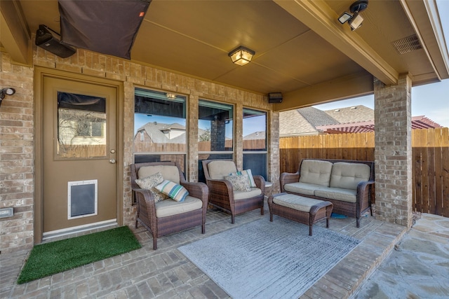 view of patio / terrace with visible vents, fence, and outdoor lounge area