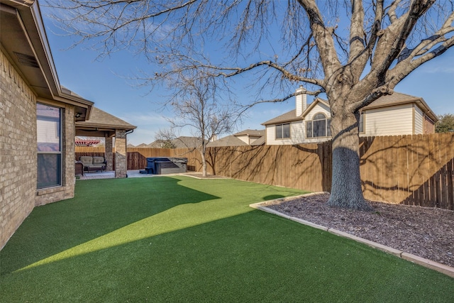 view of yard featuring a patio area and a fenced backyard