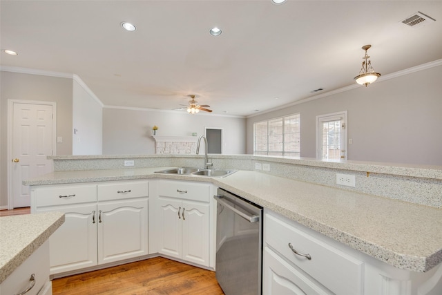 3409 Windridge Dr, Garland, TX 75043 - kitchen featuring stainless steel dishwasher, a sink, crown molding, a ceiling fan, and light wood-type flooring
