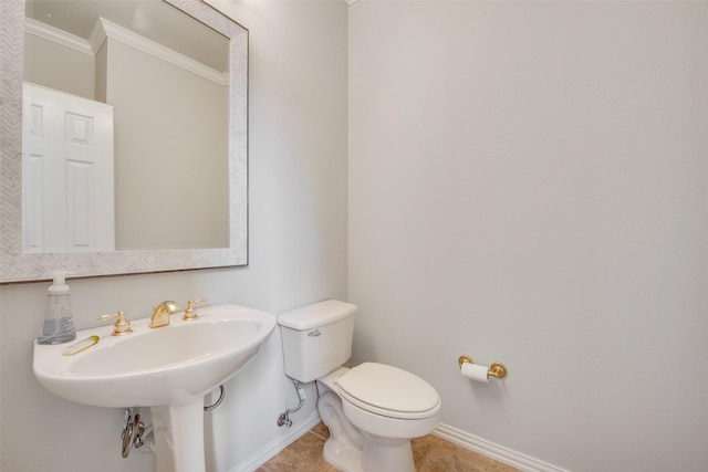 3409 Windridge Dr, Garland, TX 75043 - bathroom with crown molding, baseboards, toilet, and tile patterned flooring