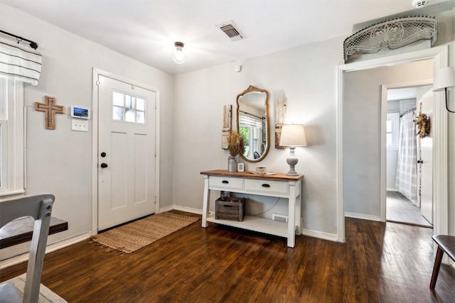 entryway featuring a wealth of natural light, wood-type flooring, visible vents, and baseboards