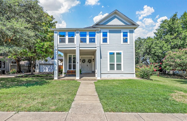 view of front facade featuring covered porch and a front lawn