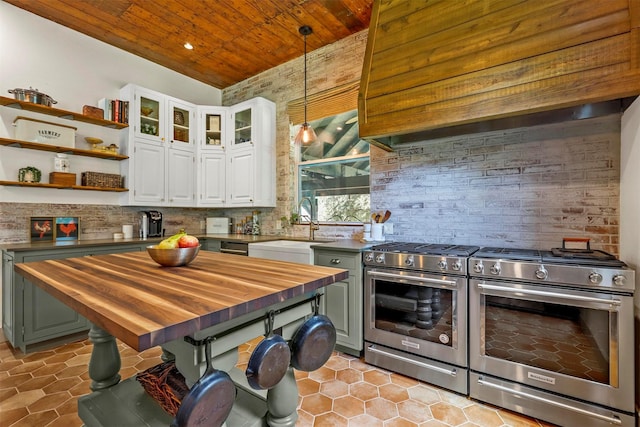 115 N 1st St, Midlothian, TX 76065 - kitchen featuring wooden counters, stainless steel range with gas cooktop, wood ceiling, a sink, and recessed lighting