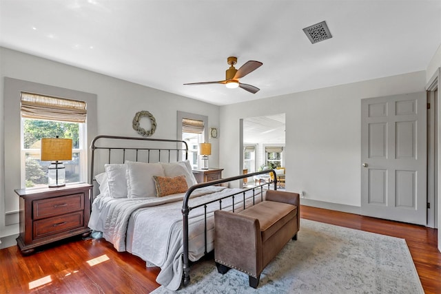 115 N 1st St, Midlothian, TX 76065 - bedroom with dark wood finished floors and ceiling fan