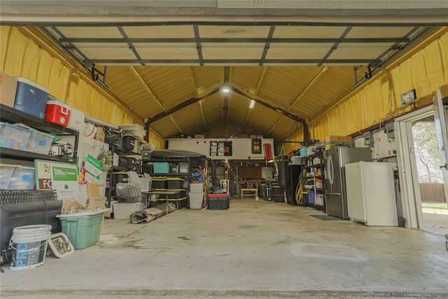 115 N 1st St, Midlothian, TX 76065 - garage with stainless steel fridge with ice dispenser and freestanding refrigerator