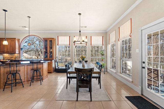 dining space featuring visible vents, a chandelier, light tile patterned floors, and plenty of natural light