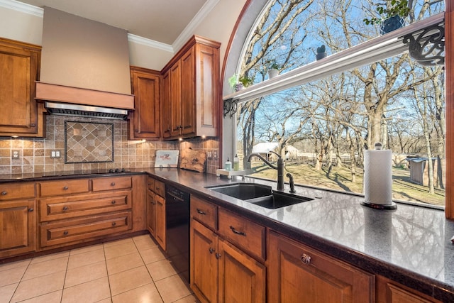 kitchen with crown molding, a sink, black appliances, brown cabinetry, and custom exhaust hood