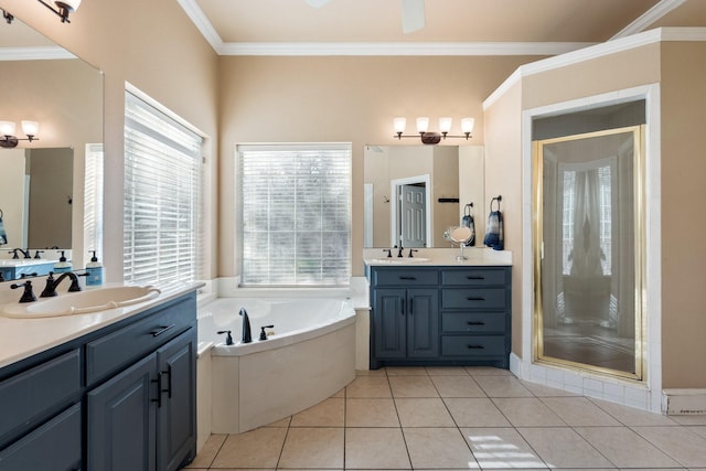 bathroom featuring a shower stall, crown molding, a sink, and a garden tub