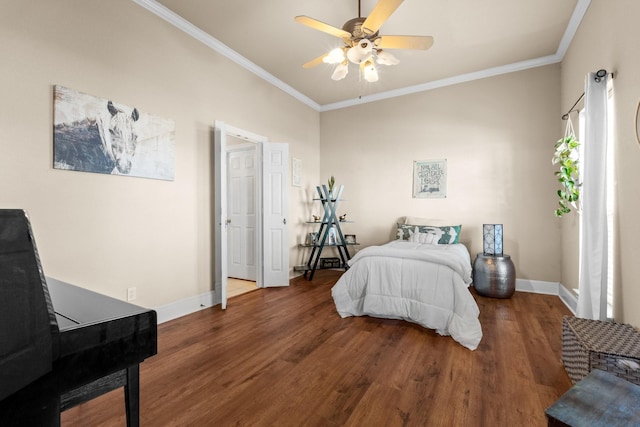 bedroom featuring ornamental molding, baseboards, and wood finished floors