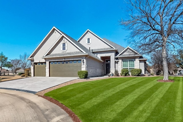 view of front facade featuring a garage, driveway, stone siding, stucco siding, and a front lawn