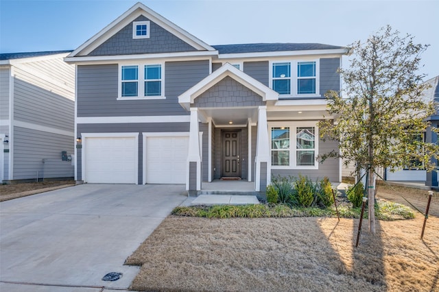 craftsman-style home with a garage and concrete driveway