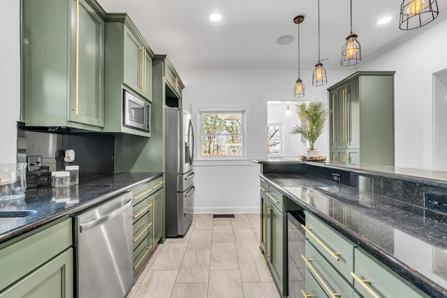 kitchen featuring stainless steel appliances, recessed lighting, and green cabinets