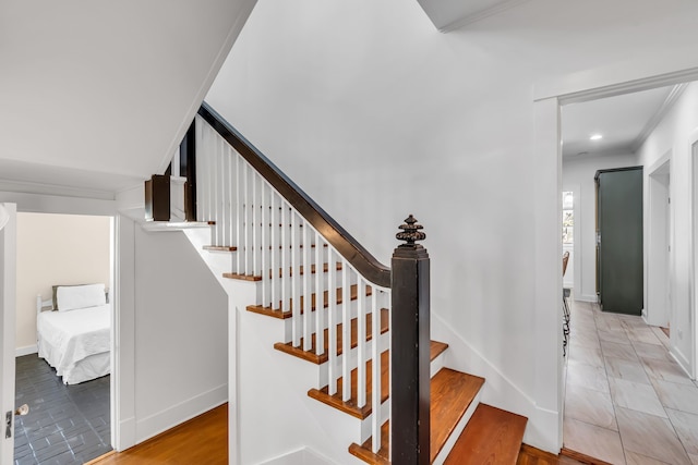 staircase featuring baseboards