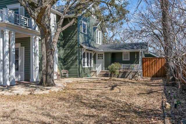 view of front of house featuring a porch and a balcony