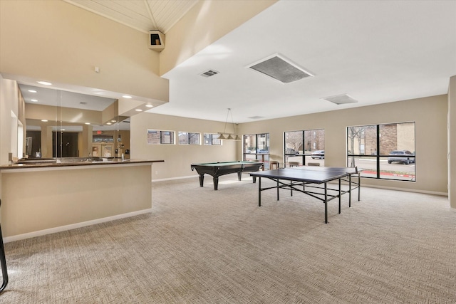 rec room featuring light carpet, a wealth of natural light, visible vents, and baseboards