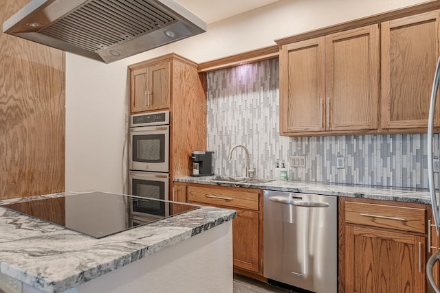 310 County Road 336 Unit B, Tuscola, TX 79562 - kitchen featuring appliances with stainless steel finishes, light stone countertops, a sink, and exhaust hood