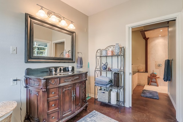 310 County Road 336 Unit B, Tuscola, TX 79562 - bathroom featuring baseboards, vanity, and concrete floors
