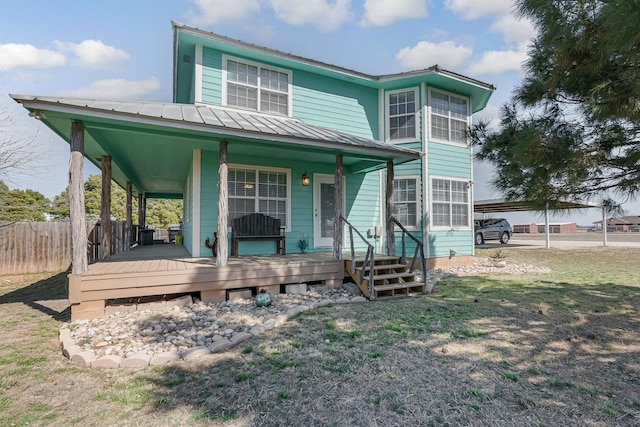 310 County Road 336 Unit B, Tuscola, TX 79562 - view of front of property with fence, a standing seam roof, a front yard, and metal roof