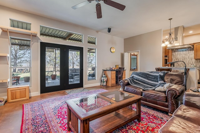 310 County Road 336 Unit B, Tuscola, TX 79562 - living area with ceiling fan with notable chandelier and baseboards
