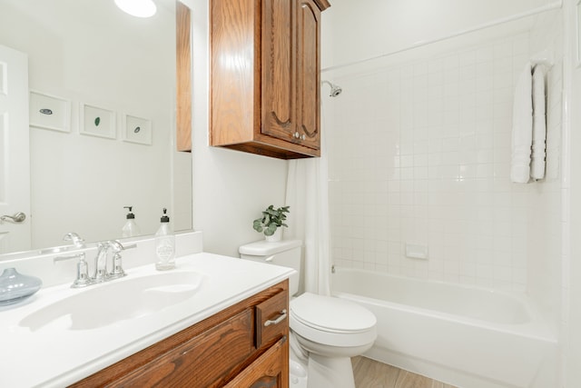 full bath with toilet, shower / tub combo, and vanity