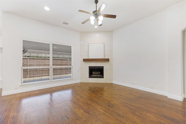 unfurnished living room with visible vents, baseboards, wood finished floors, and a ceiling fan