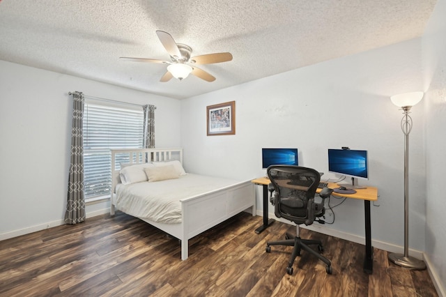 bedroom featuring a textured ceiling, wood finished floors, and baseboards