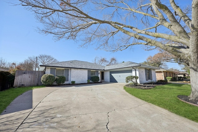 single story home with a garage, driveway, fence, a front lawn, and brick siding