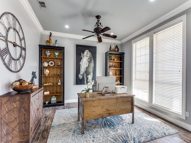 home office featuring ornamental molding, wood finished floors, and visible vents