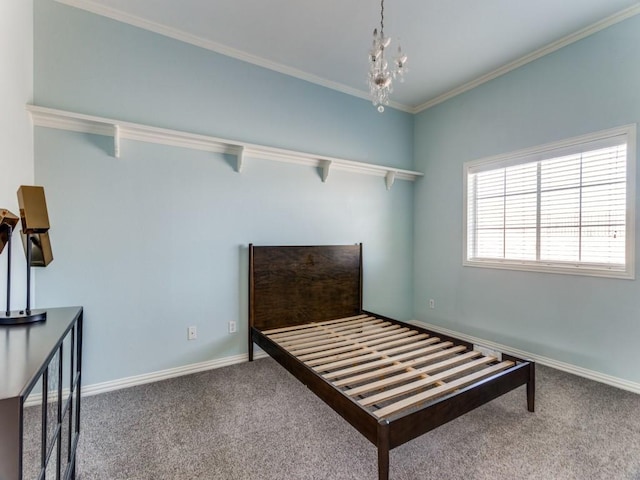 carpeted bedroom featuring a chandelier, crown molding, and baseboards