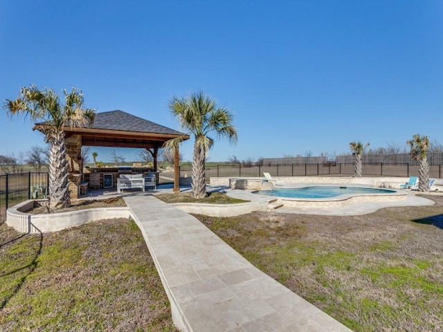 view of swimming pool with a gazebo, fence, and a fenced in pool