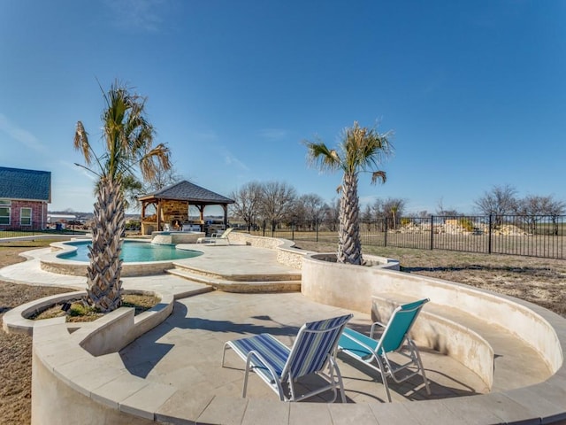 view of swimming pool featuring a fenced in pool, a patio, a gazebo, and fence