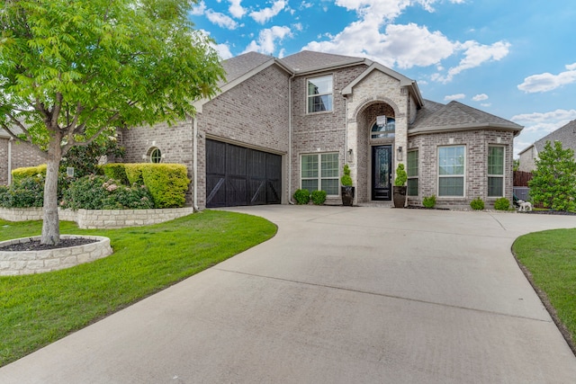 425 Brook Meadow Dr, Midlothian, TX 76065 - view of front facade with brick siding, driveway, a front lawn, roof with shingles, and an attached garage