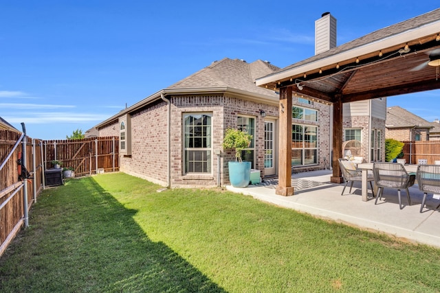 425 Brook Meadow Dr, Midlothian, TX 76065 - back of house with brick siding, a patio, a chimney, and a shingled roof