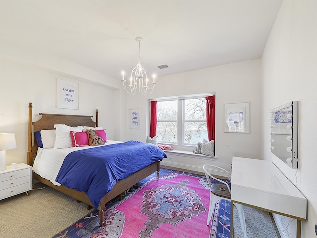 bedroom featuring visible vents, a notable chandelier, and baseboards