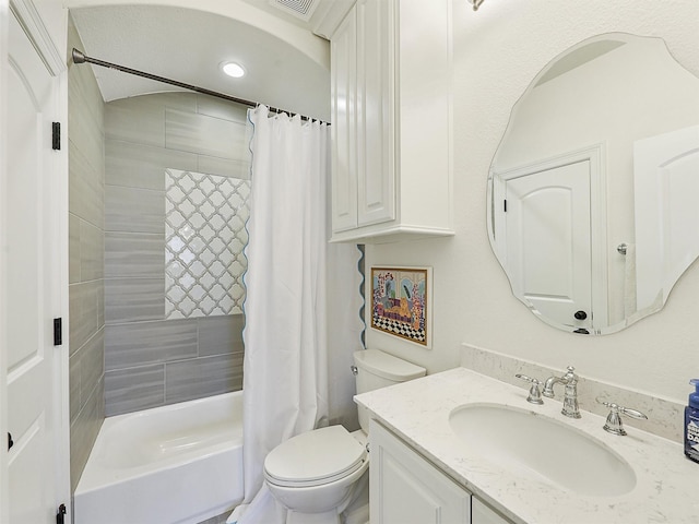 bathroom featuring vanity, shower / bath combination with curtain, and toilet