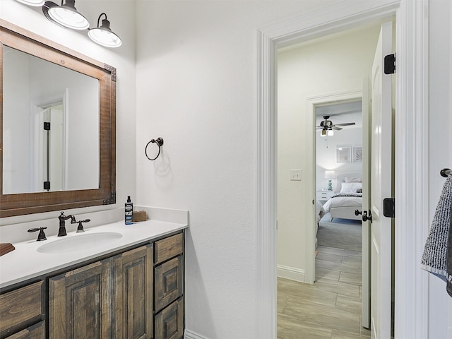 ensuite bathroom featuring connected bathroom and vanity