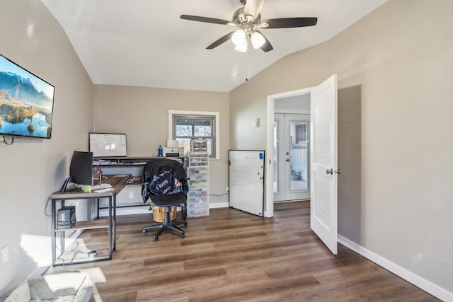 office space featuring lofted ceiling, wood finished floors, and baseboards