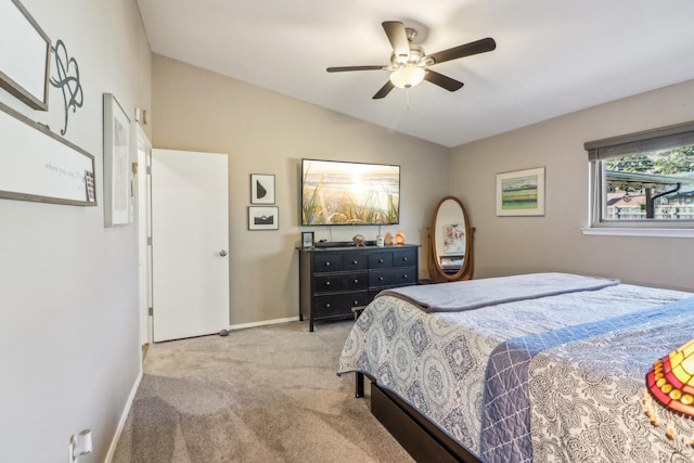 bedroom with lofted ceiling, baseboards, ceiling fan, and carpet