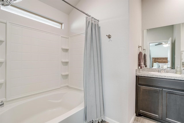 full bathroom with baseboards, shower / tub combo with curtain, and vanity