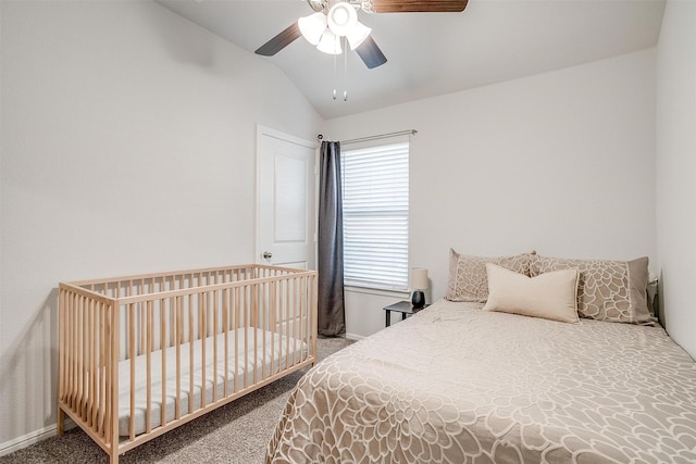 bedroom featuring a ceiling fan, carpet, and vaulted ceiling