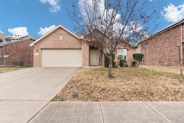 ranch-style house featuring brick siding, a front yard, central AC, a garage, and driveway