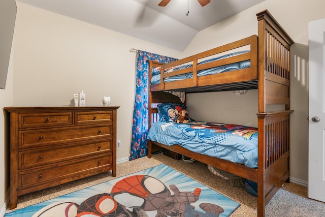 bedroom featuring lofted ceiling, light carpet, ceiling fan, and baseboards