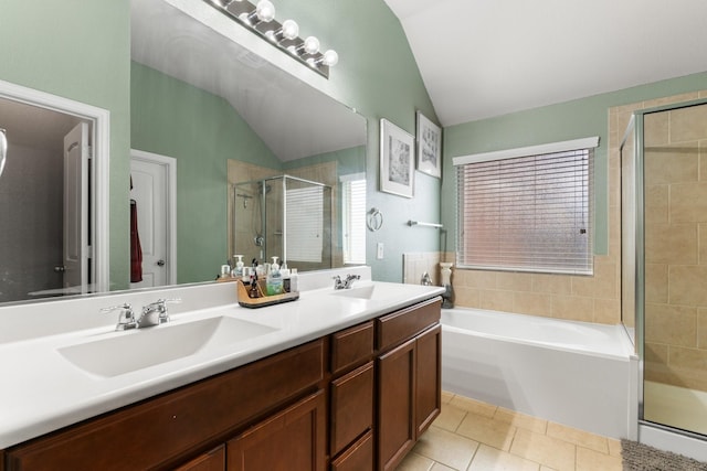 bathroom with a stall shower, tile patterned floors, a sink, vaulted ceiling, and a bath